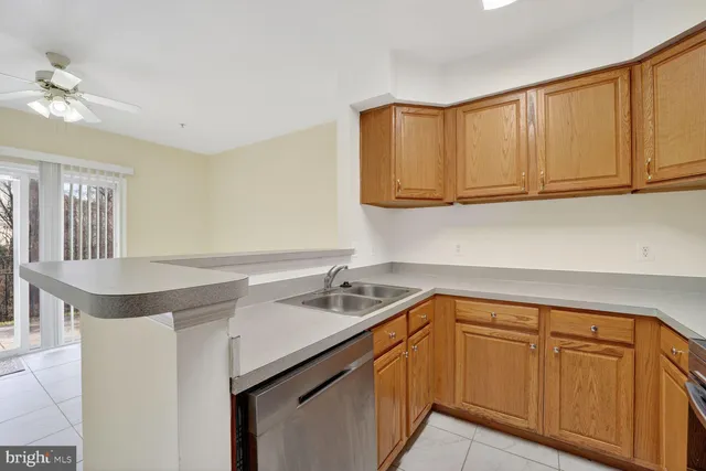 a kitchen with a sink cabinets and appliances