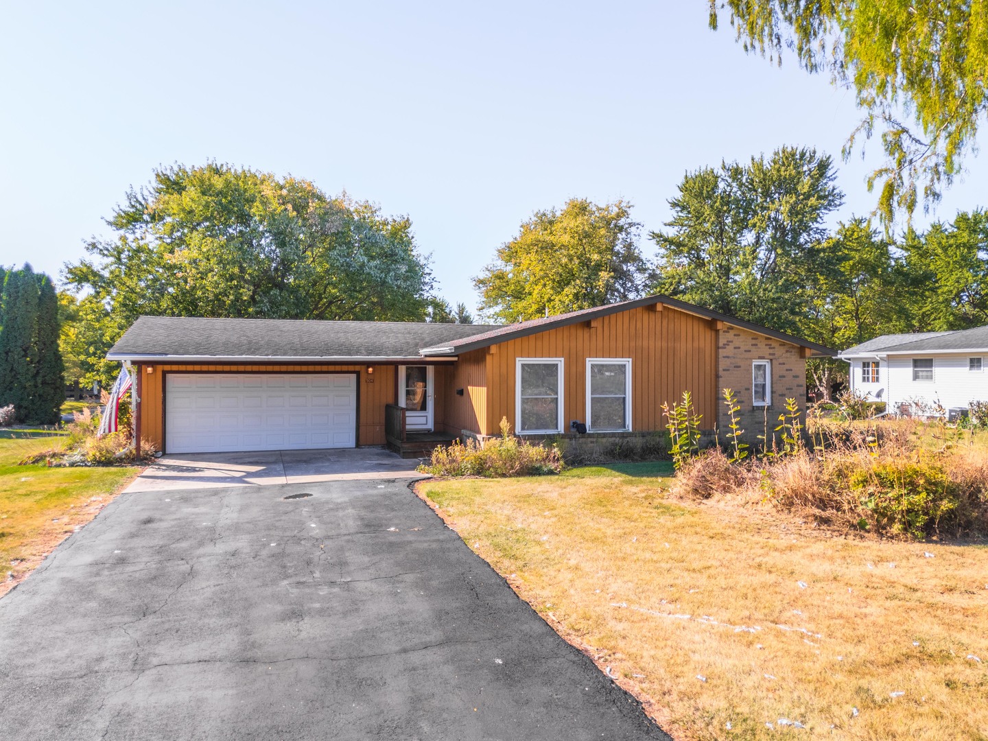 504 West Jackson Street Cullom, IL 60929 - Photo 2 of 51 a front view of house with yard and trees in the background