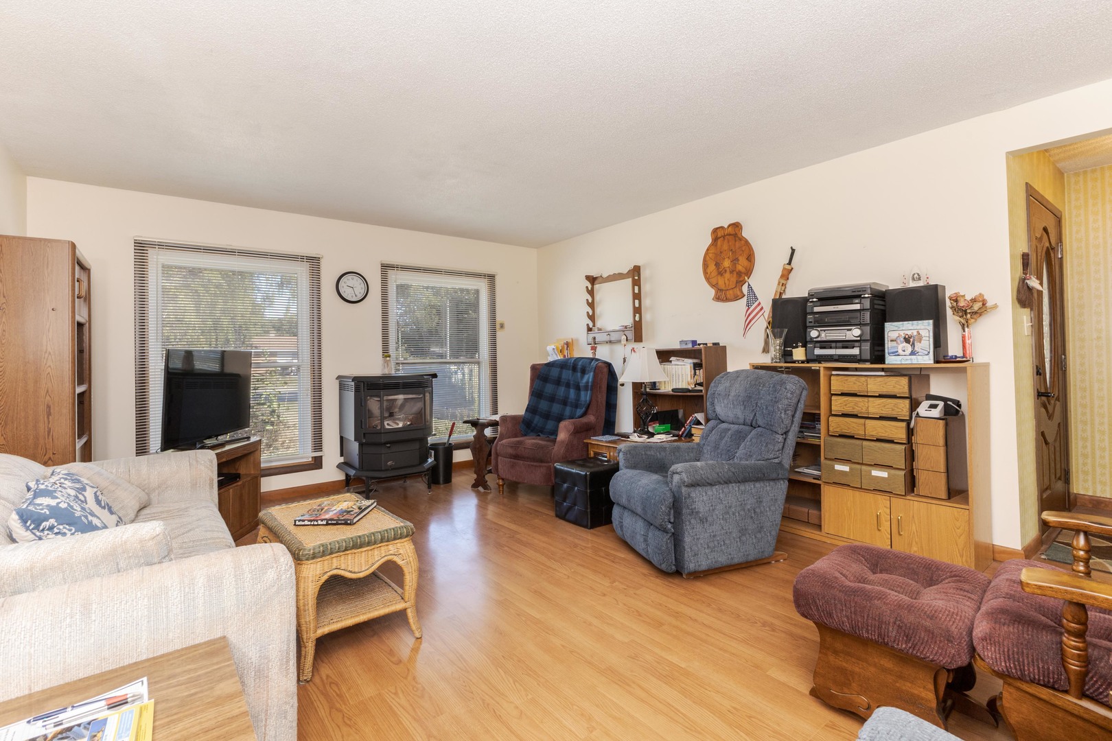504 West Jackson Street Cullom, IL 60929 - Photo 27 of 51 a living room with furniture and a fireplace
