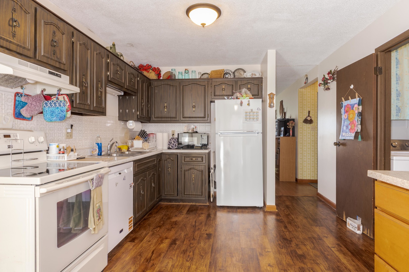 504 West Jackson Street Cullom, IL 60929 - Photo 29 of 51 a kitchen with a refrigerator and a sink