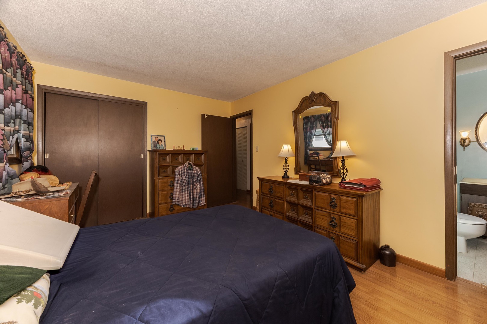 504 West Jackson Street Cullom, IL 60929 - Photo 35 of 51 a bedroom with a bed and a dresser