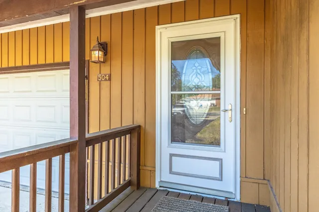 a view of balcony with wooden floor
