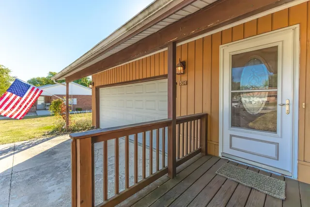 a view of a park with large trees