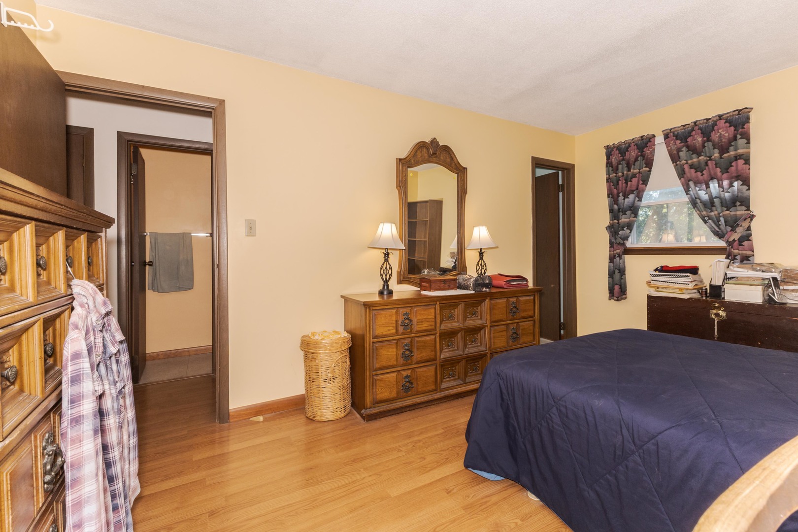 504 West Jackson Street Cullom, IL 60929 - Photo 48 of 51 a bedroom with a bed and a dresser with mirror