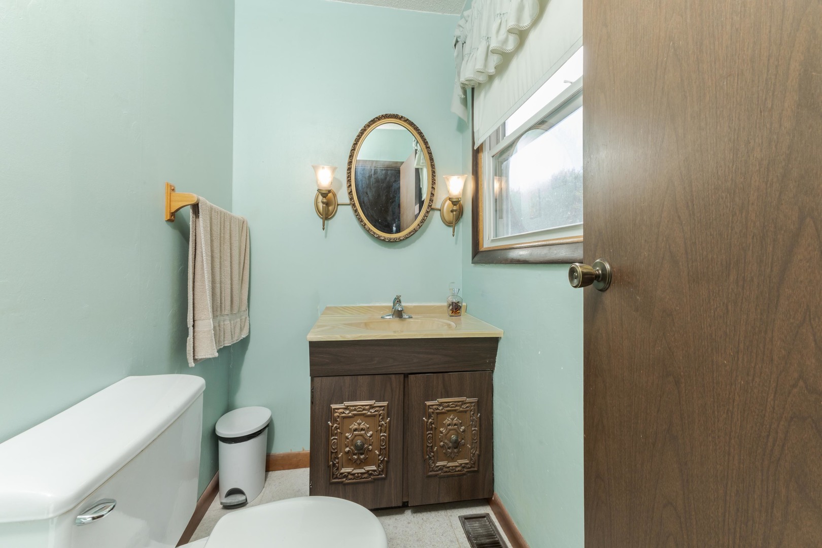 504 West Jackson Street Cullom, IL 60929 - Photo 49 of 51 a bathroom with a toilet a sink and a mirror