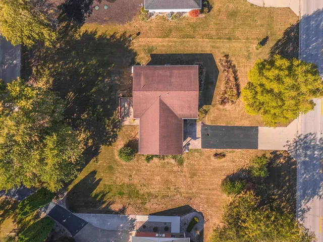 an aerial view of residential houses with outdoor space