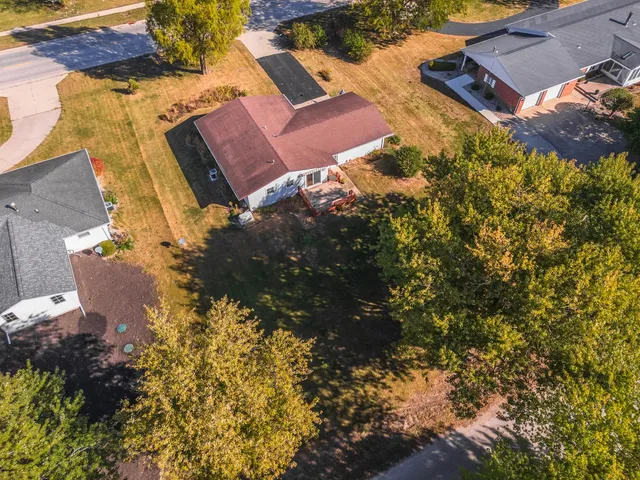 an aerial view of house with yard