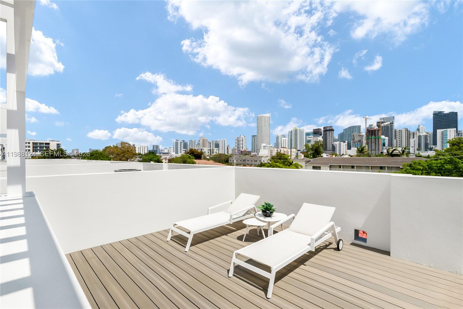 721 Southwest 11th Street, Unit E Miami, FL 33129 - Photo 18 of 26 a view of roof deck with patio