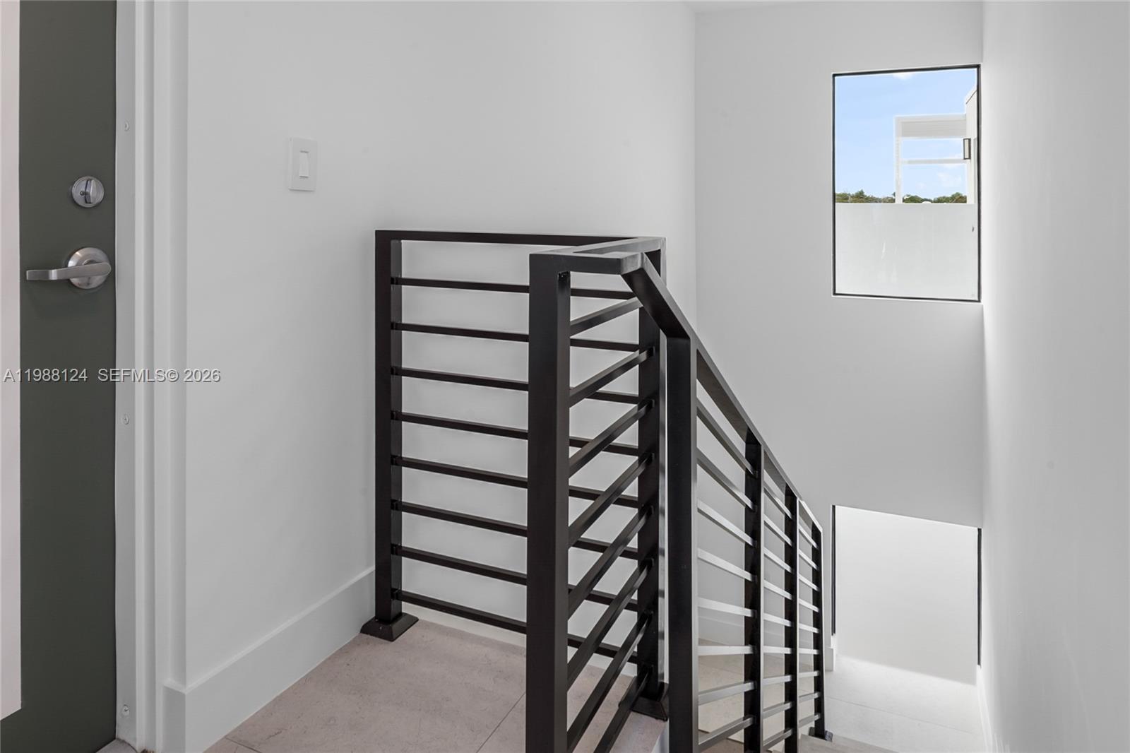 721 Southwest 11th Street, Unit E Miami, FL 33129 - Photo 20 of 26 a view of entryway with stairs and wooden floor