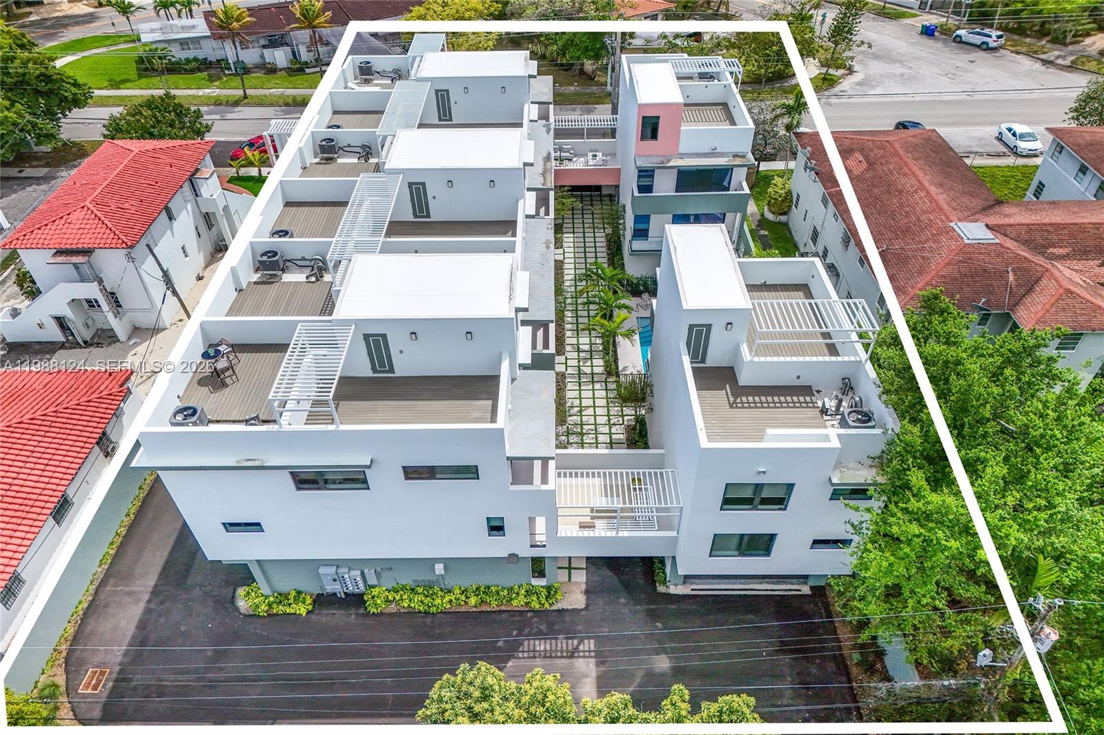 721 Southwest 11th Street, Unit E Miami, FL 33129 - Photo 25 of 26 an aerial view of residential houses with outdoor space and parking