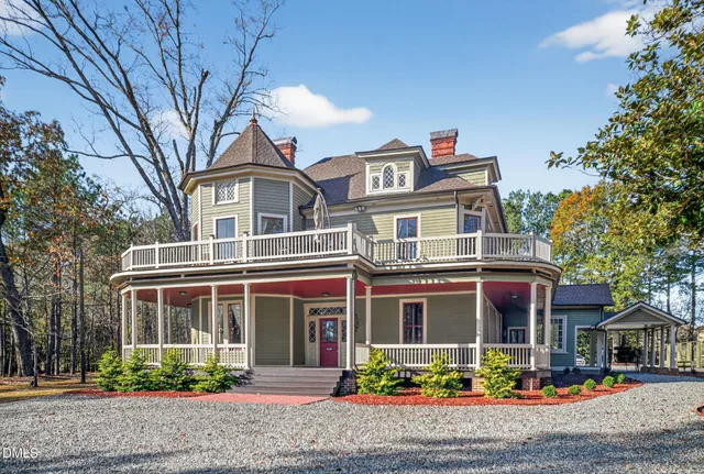 a front view of a residential apartment building with a yard