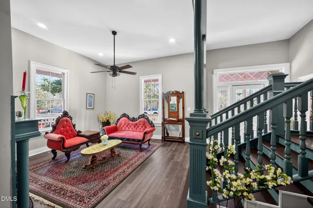 a living room with fireplace furniture and a flat screen tv