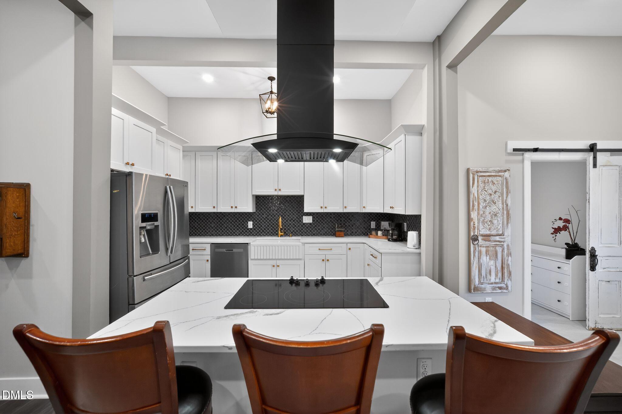 6325 Whitted Road Fuquay-Varina, NC 27526 - Photo 19 of 57 a large kitchen with a table and chairs
