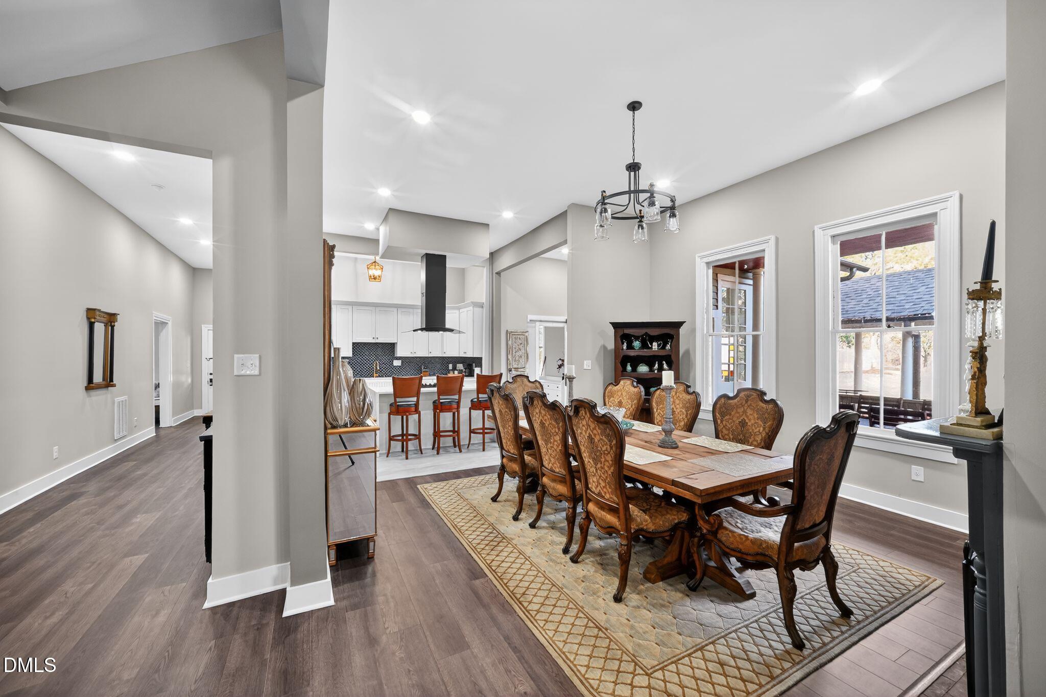 6325 Whitted Road Fuquay-Varina, NC 27526 - Photo 21 of 57 a view of a dining room with furniture window and wooden floor
