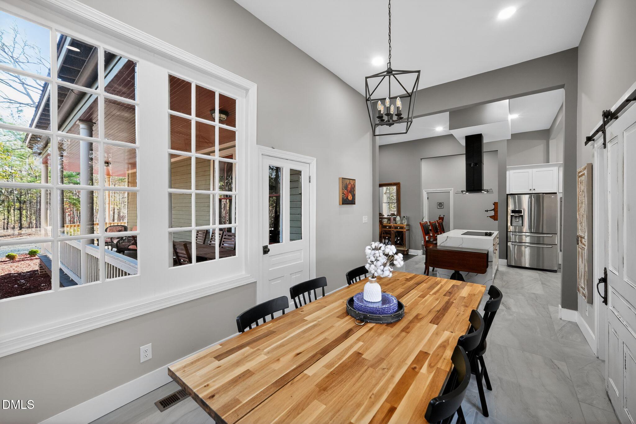 6325 Whitted Road Fuquay-Varina, NC 27526 - Photo 24 of 57 a view of a dining room with furniture window and wooden floor