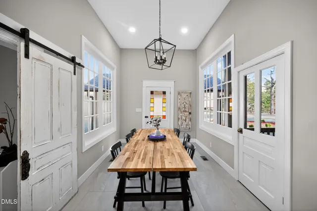 a bedroom with furniture and a flat screen tv