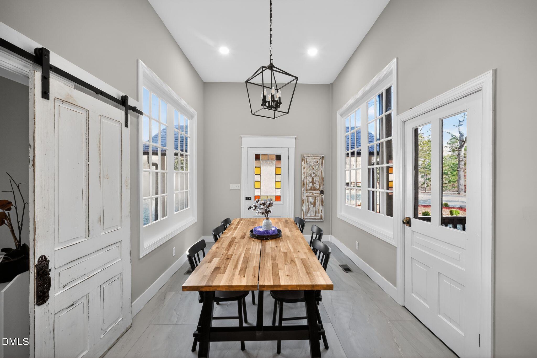 6325 Whitted Road Fuquay-Varina, NC 27526 - Photo 26 of 57 a view of a dining room with furniture window and wooden floor