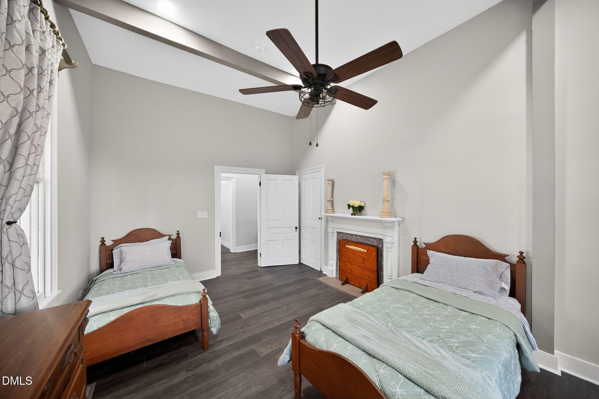 6325 Whitted Road Fuquay-Varina, NC 27526 - Photo 31 of 57 a bedroom with a bed and a chandelier