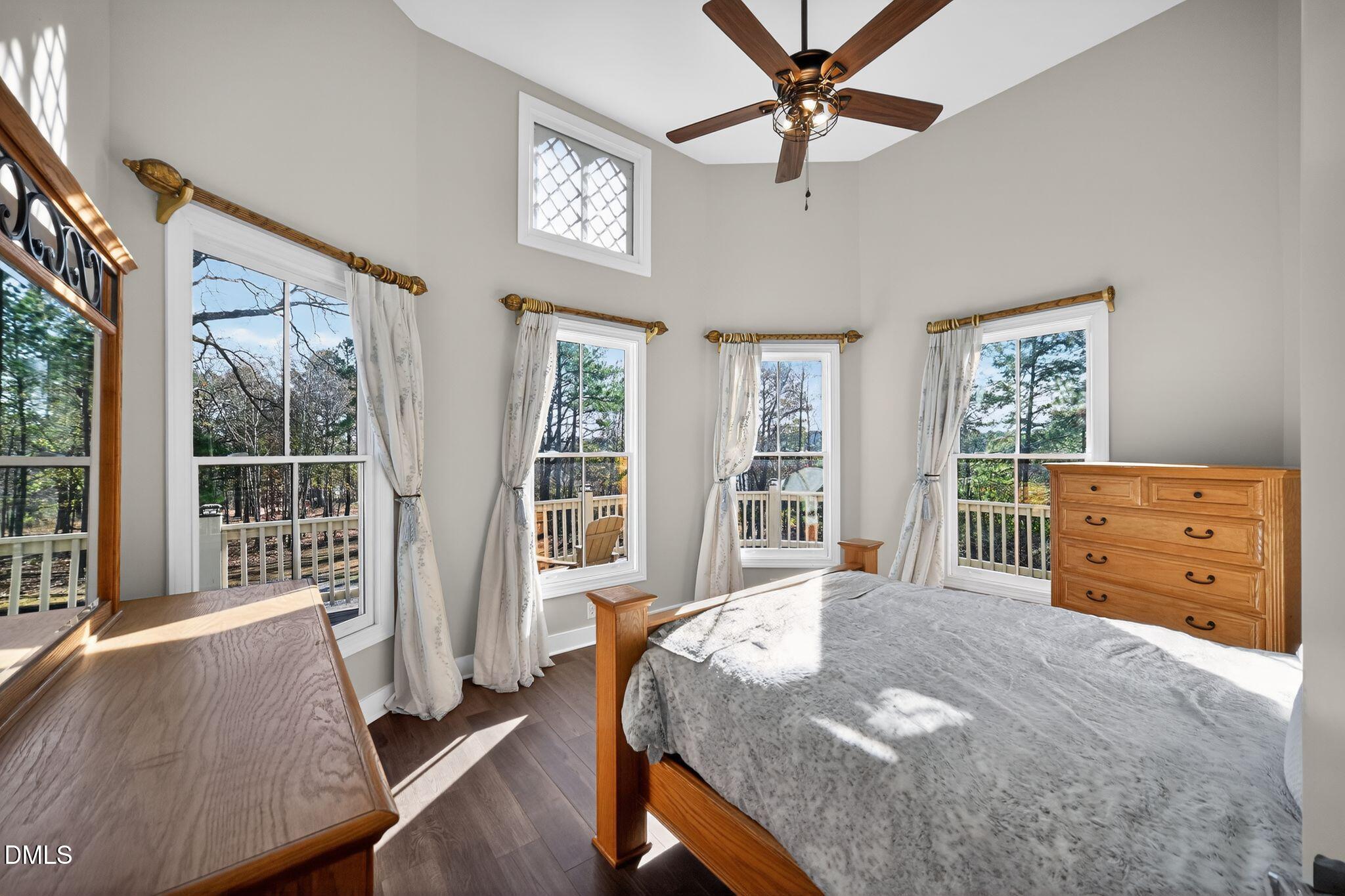 6325 Whitted Road Fuquay-Varina, NC 27526 - Photo 33 of 57 a spacious bedroom with a bed and a large window
