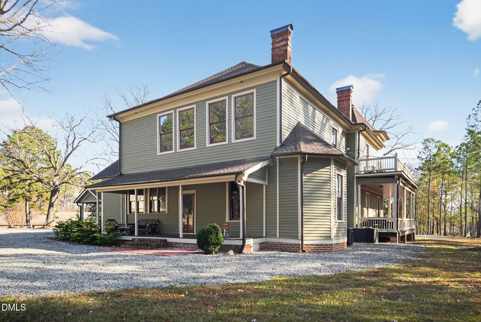 6325 Whitted Road Fuquay-Varina, NC 27526 - Photo 4 of 57 a front view of a house with a yard table and chairs