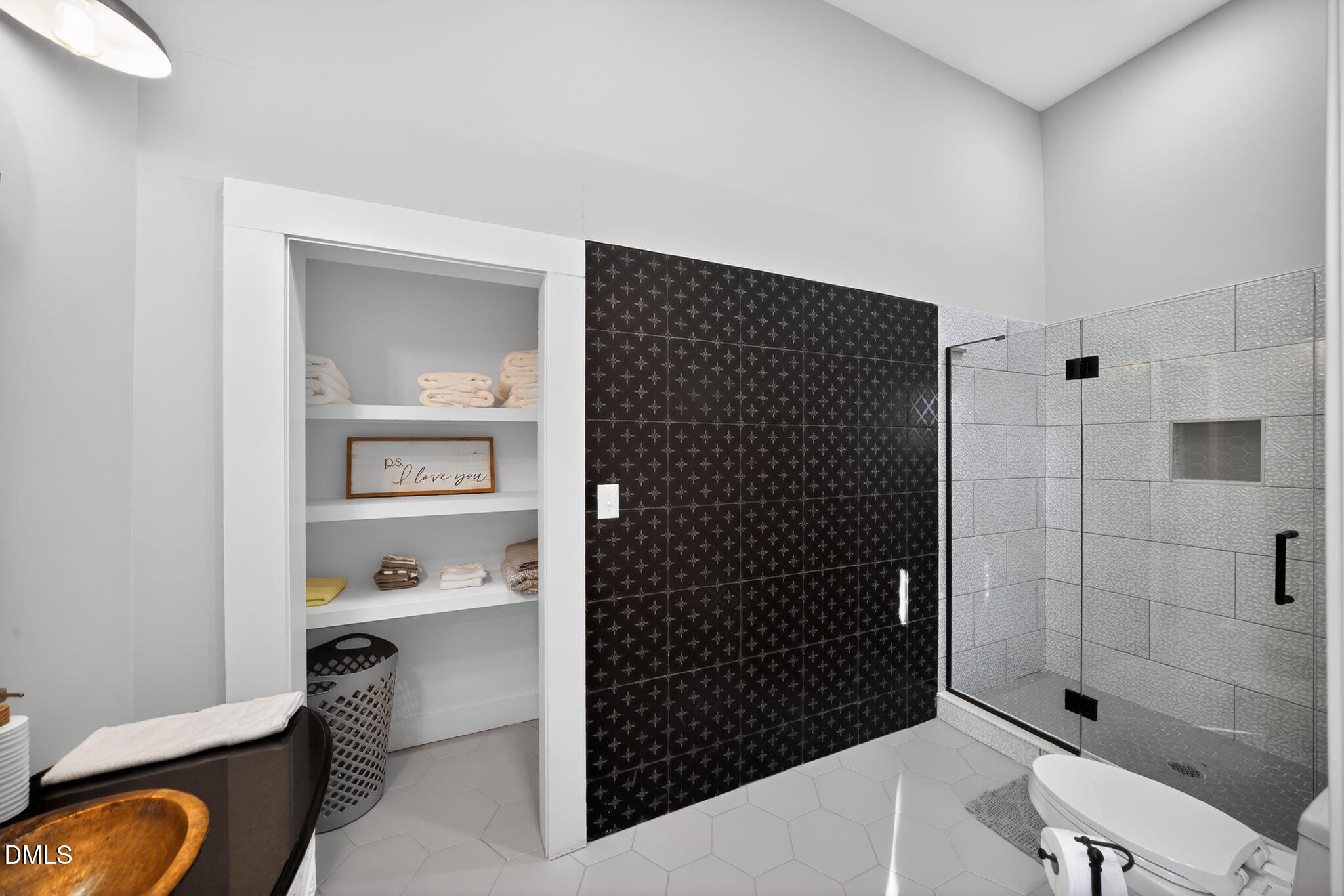 6325 Whitted Road Fuquay-Varina, NC 27526 - Photo 49 of 57 a bathroom with a shower toilet and sink