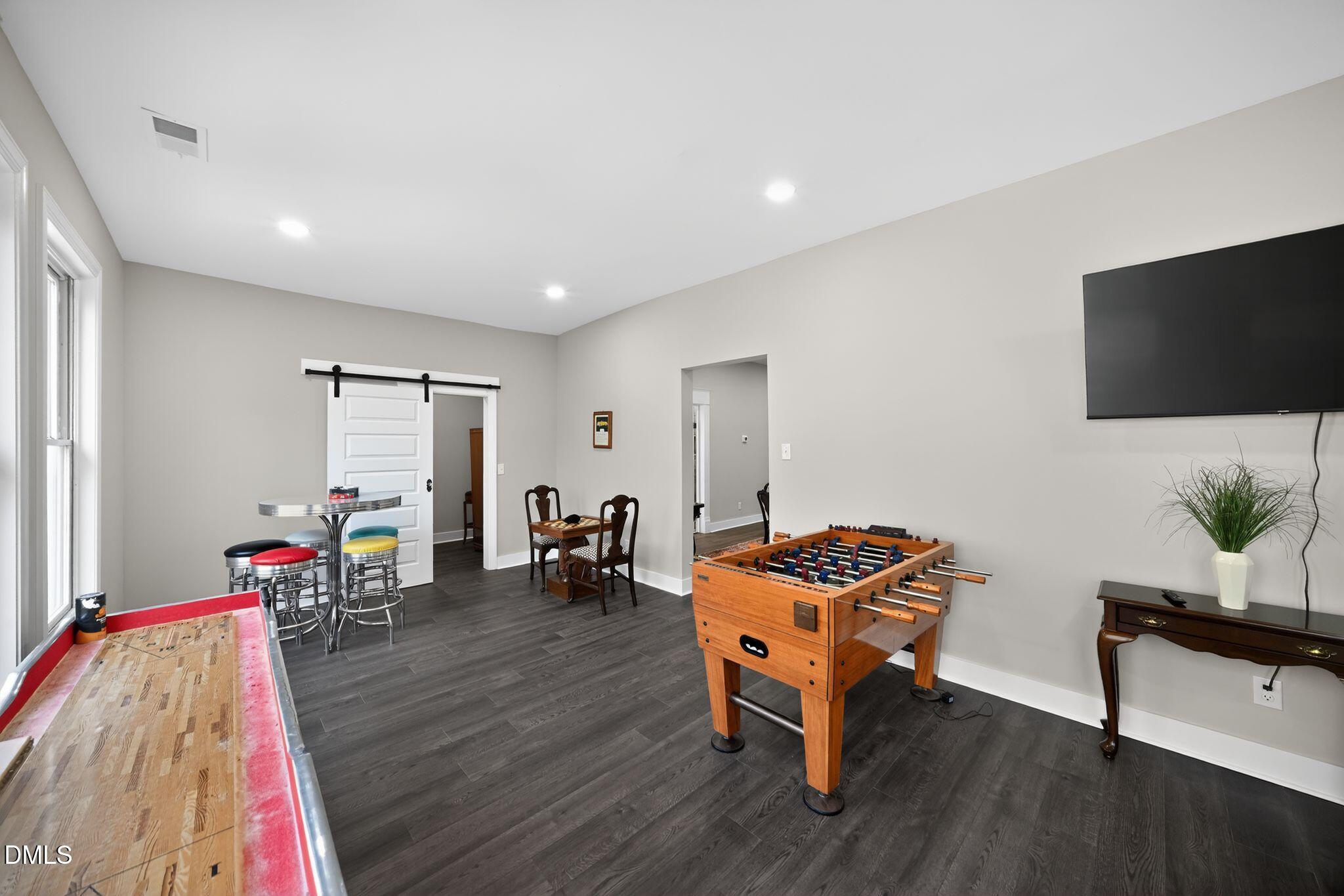 6325 Whitted Road Fuquay-Varina, NC 27526 - Photo 54 of 57 a living room with furniture and a flat screen tv