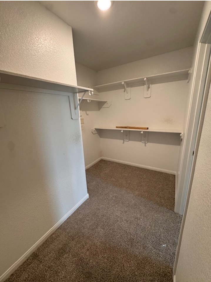 13626 Kit Run Splendora, TX 77372 - Photo 7 of 43 a view of an empty walk in closet