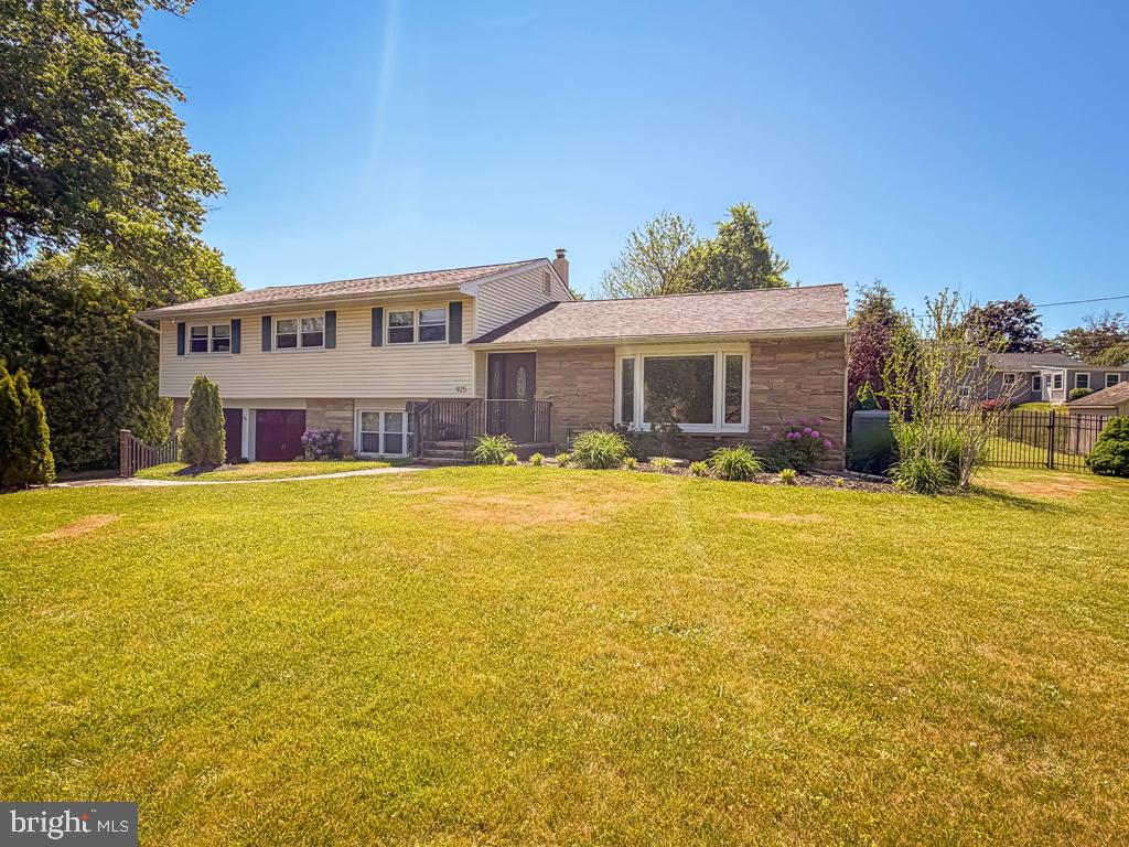925 Big Oak Road Yardley, PA 19067 - Photo 6 of 51 a front view of a house with a yard