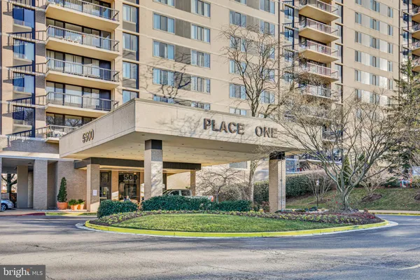 a view of a building with a yard