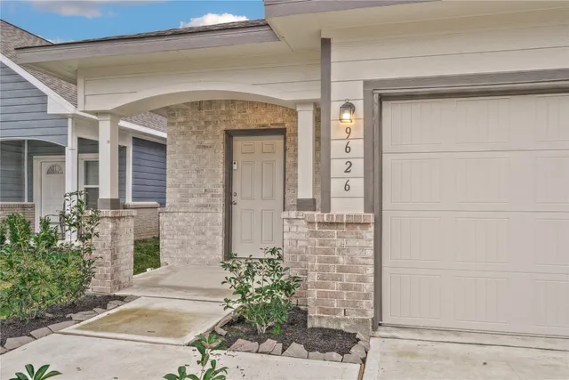 a front view of a house with a glass door