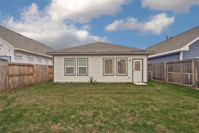 a view of a yard in front of a house