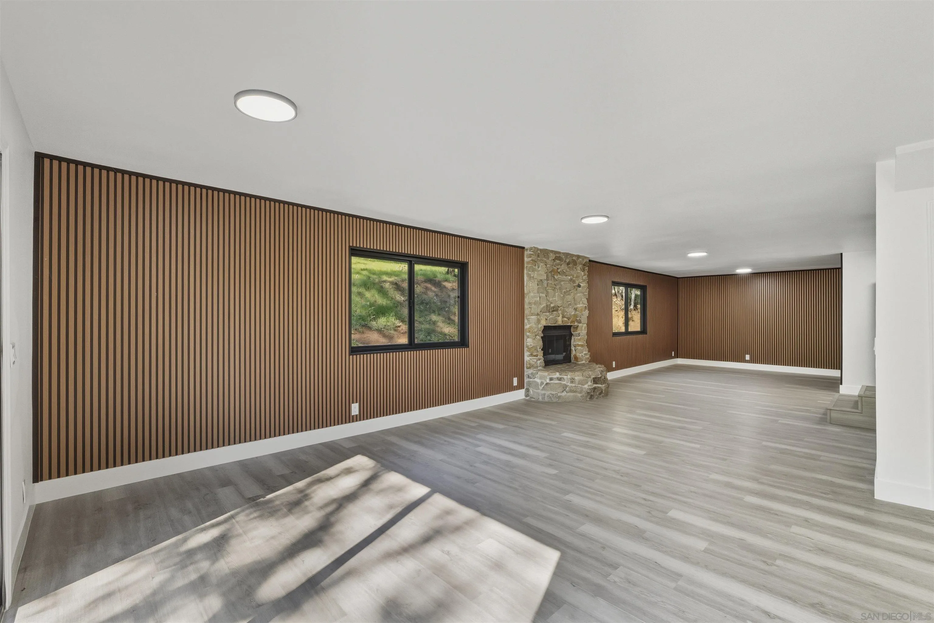11618 Johnson Lake Road Lakeside, CA 92040 - Photo 2 of 25 a view of an empty room with wooden floor and a window