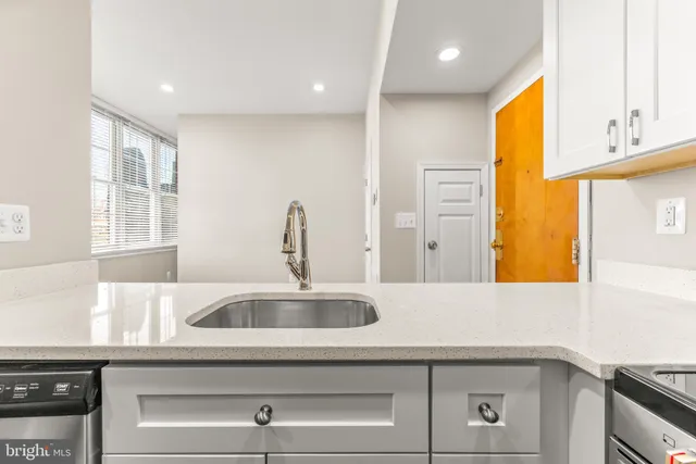 a kitchen with sink and window