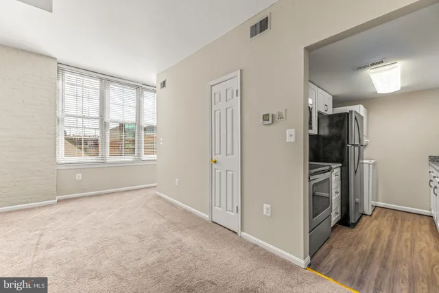a kitchen with a sink stove and refrigerator