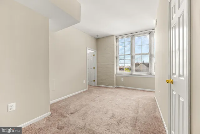 a view of hallway with closet