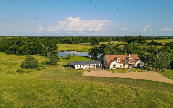 a view of a lake with houses in the back