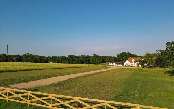 a view of a lake with a big yard