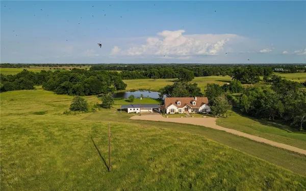 an aerial view of a house with a garden