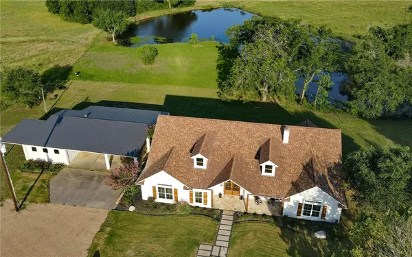 an aerial view of a houses with outdoor space swimming pool and outdoor view