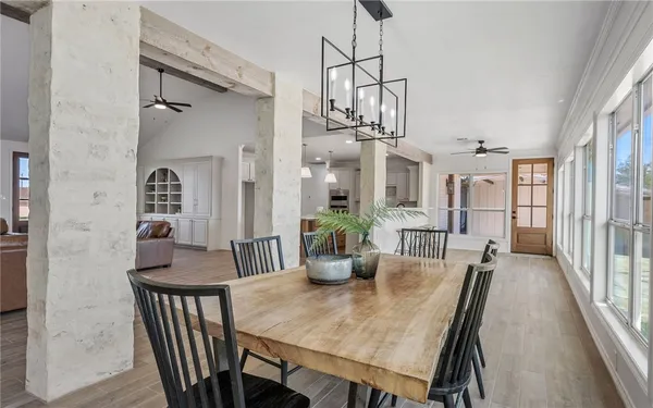 a dining room with furniture and window