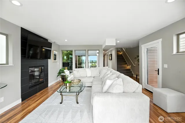 a living room with furniture fireplace and flat screen tv