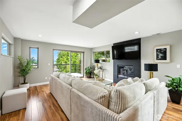 a living room with fireplace furniture and a flat screen tv