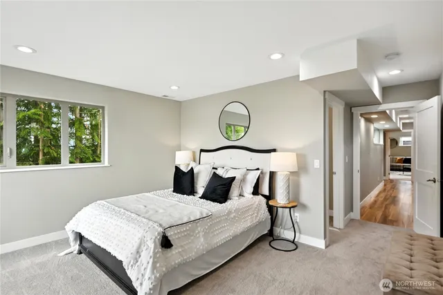 a bedroom with a bed and a lamp