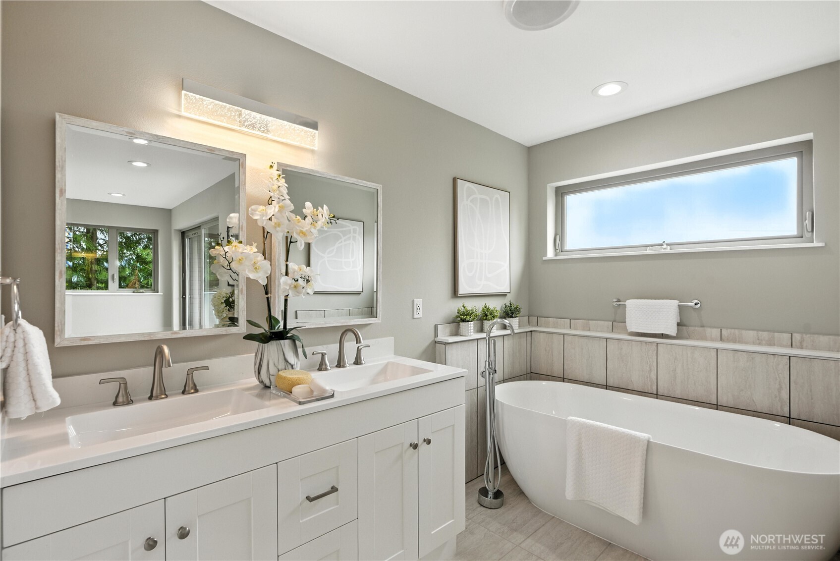 8221 South 121st Street Seattle, WA 98178 - Photo 17 of 37 a bathroom with a tub a sink and mirror