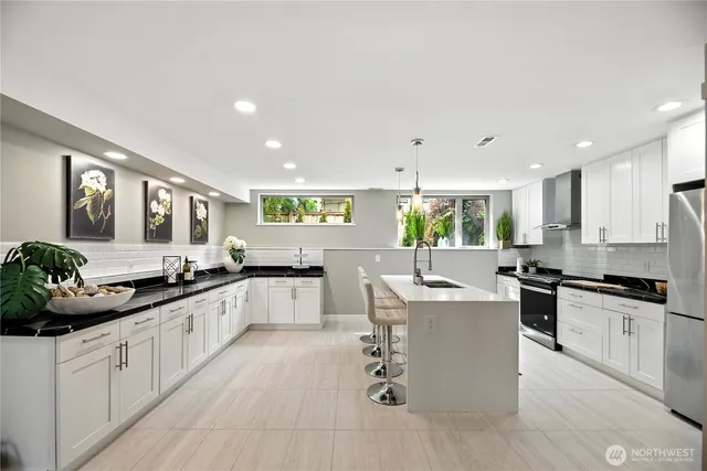 a kitchen with counter top space and stainless steel appliances