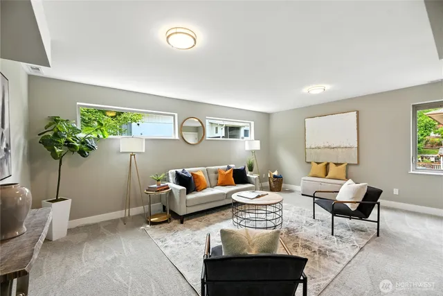 a living room with furniture potted plant and a window