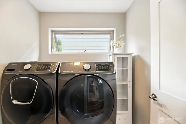 a utility room with dryer and washer