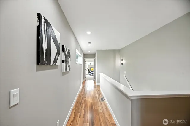 a view of a hallway with staircase