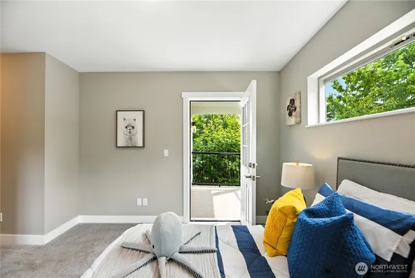 a bed room with a bed and a window