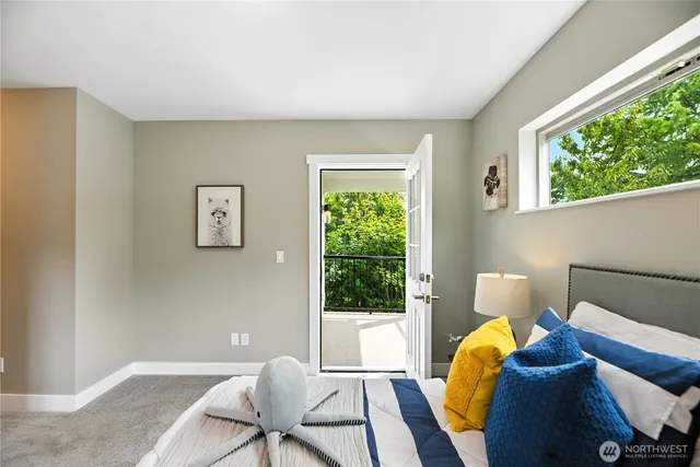 a bed room with a bed and a window